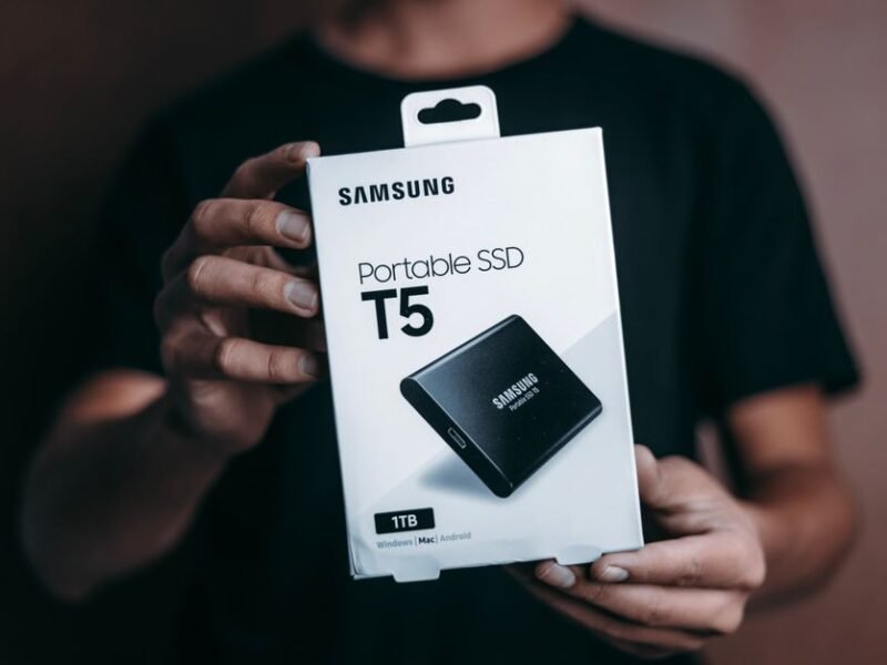 Person holding a Samsung portable SSD external drive