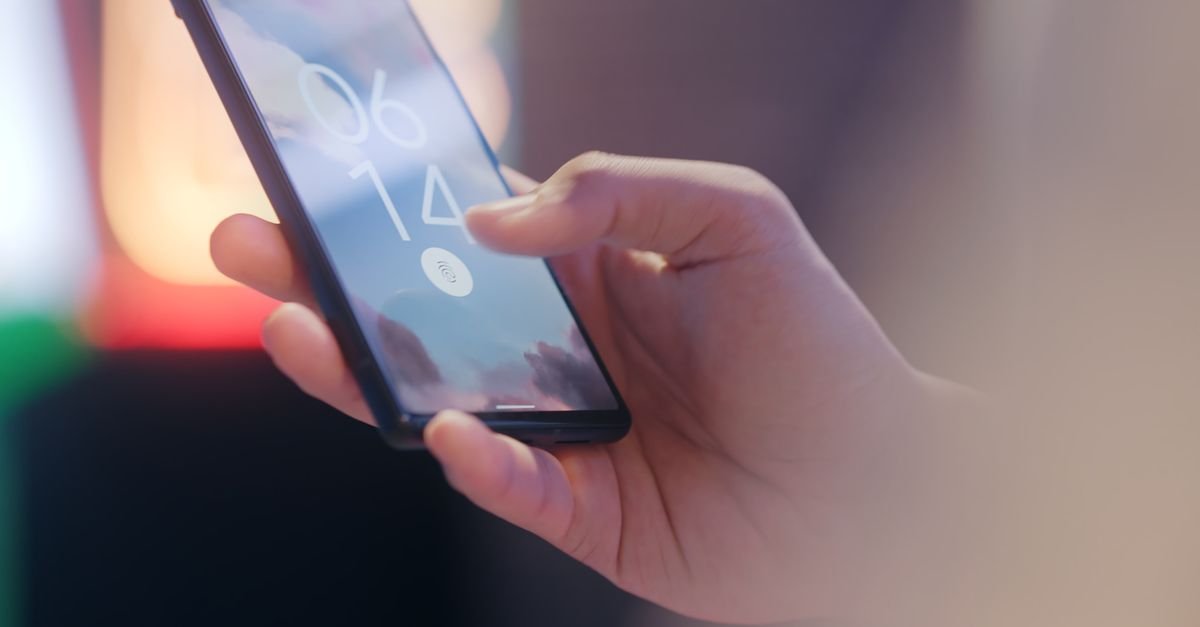 A hand holding a smartphone