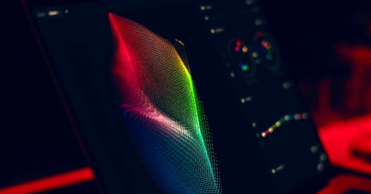 A colorful 3D data visualization on a dark laptop screen