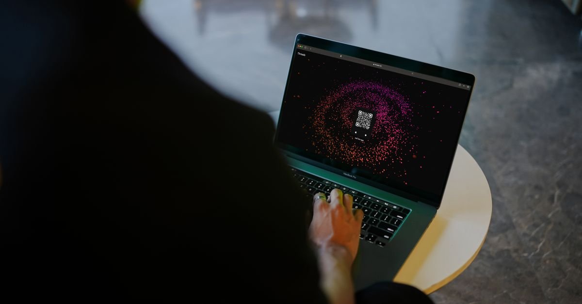 Laptop showing a digital security shield graphic