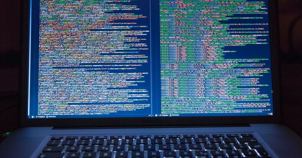 Developer working on a dual-monitor coding setup