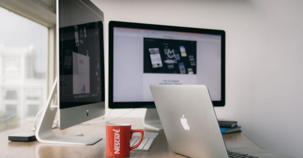 Clean desk with a computer showing a website mockup