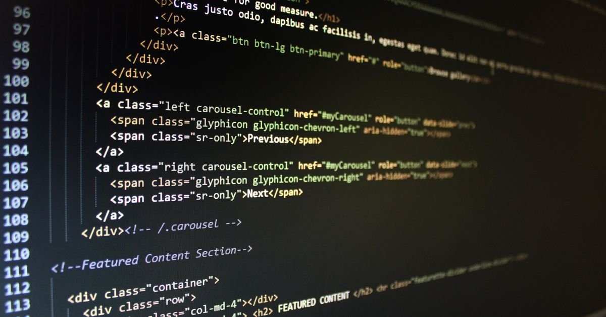 HTML code displayed on a dark monitor