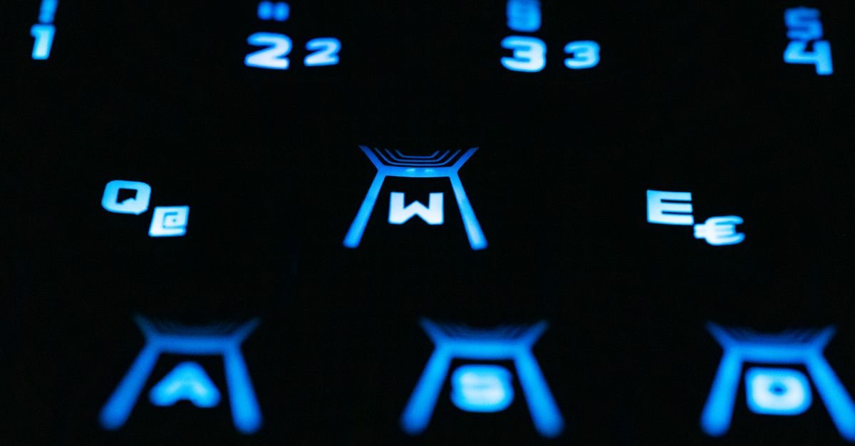 Backlit keyboard keys glowing in the dark