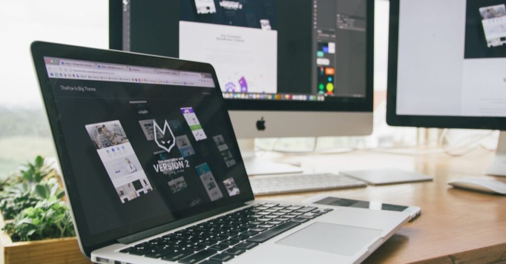 iMac on a desk showing a website design layout