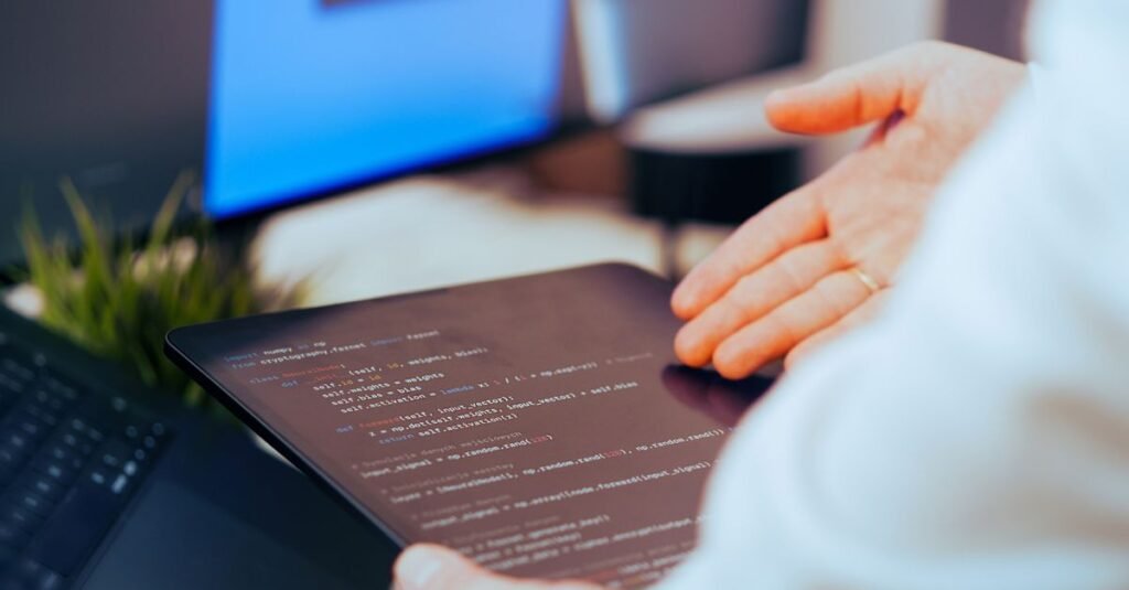 Developer working with an AI model on a laptop