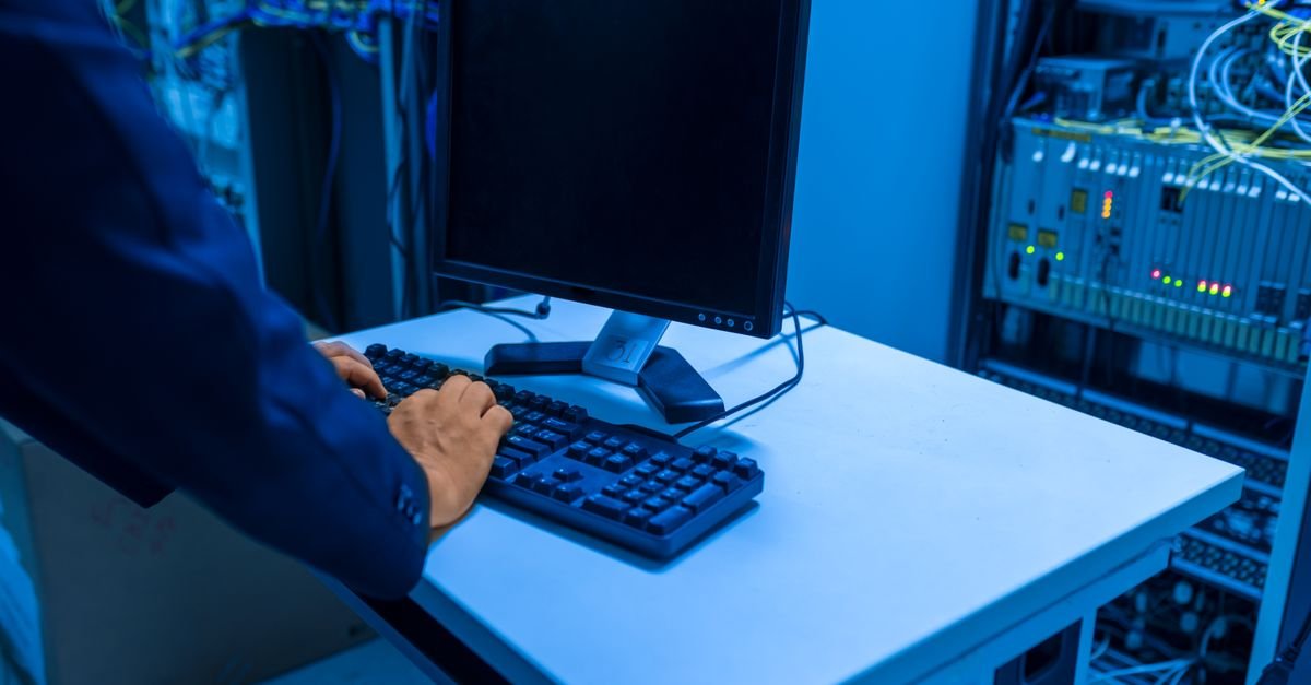A person administering a server at a console