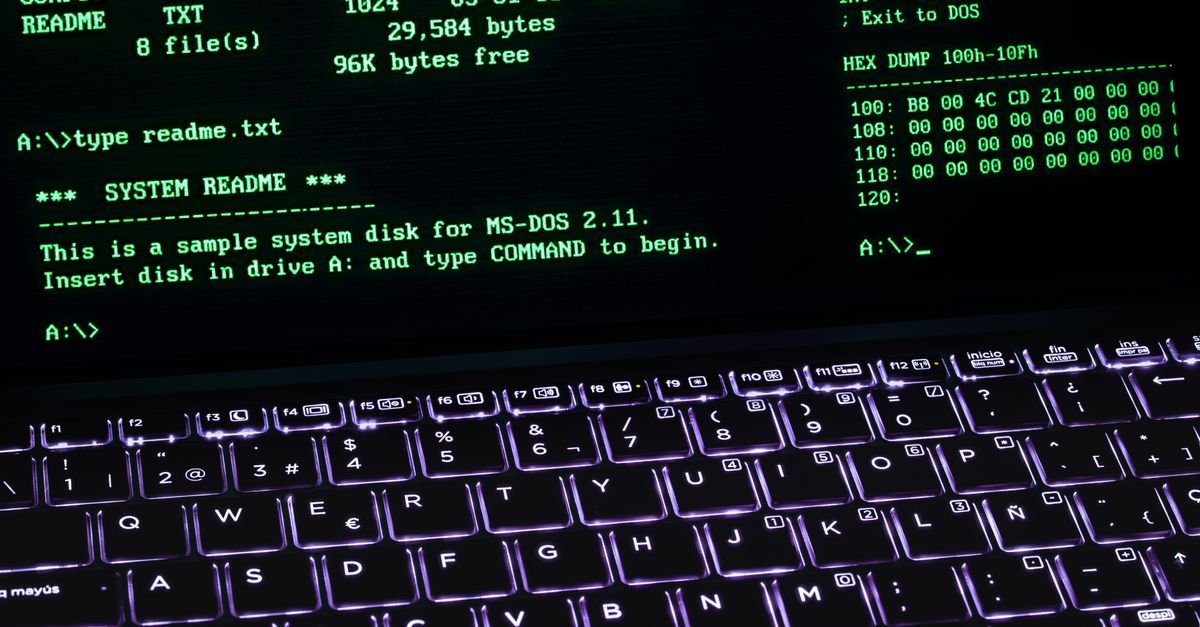 A green text terminal displayed on a laptop