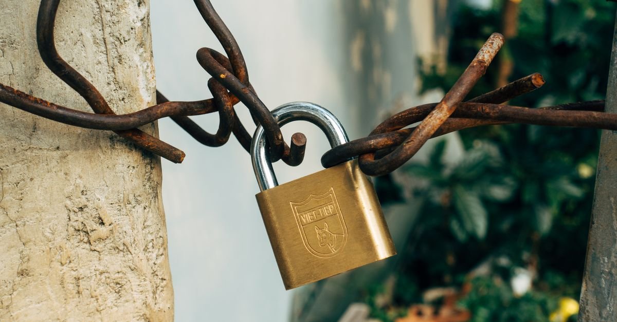 A padlock and chain securing a connection