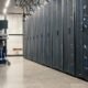 A long corridor of server racks in a data center
