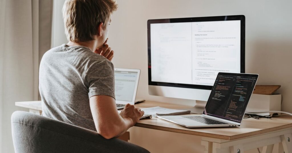 Developer weighing hosting options at a desk