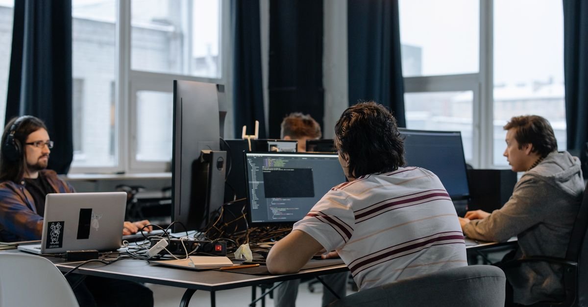 Development team collaborating at computers