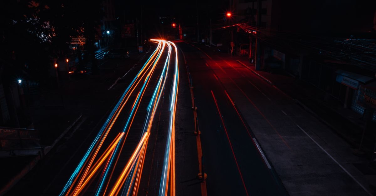 Fast light trails on a night road