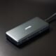 USB-C docking station hub with multiple ports and a connecting cable on a desk