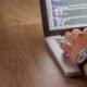 Developer editing website code on a laptop