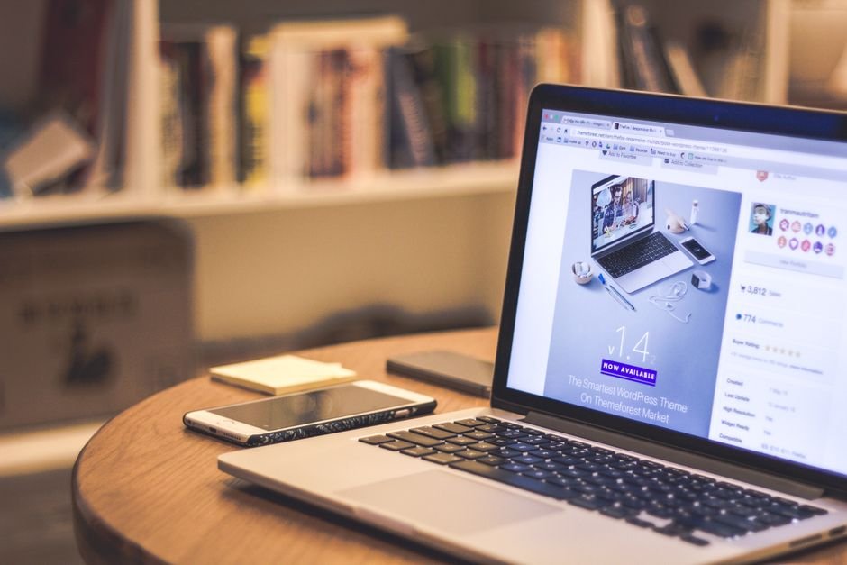 A WordPress theme website shown on a laptop
