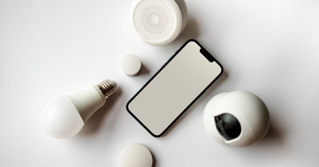 Smart home IoT devices beside a smartphone