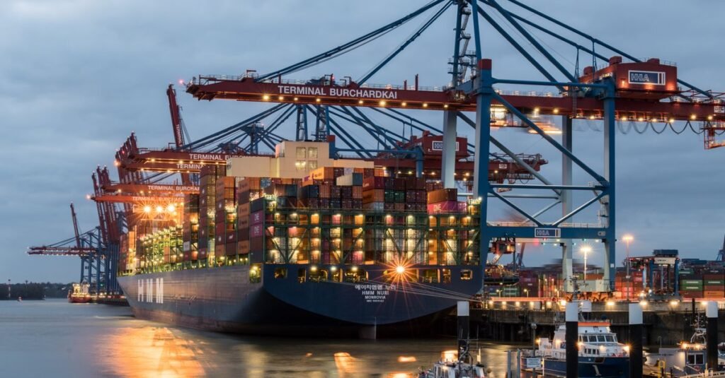 Cranes loading containers onto a ship at a port