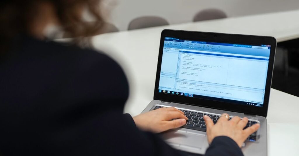 Developer coding on a laptop