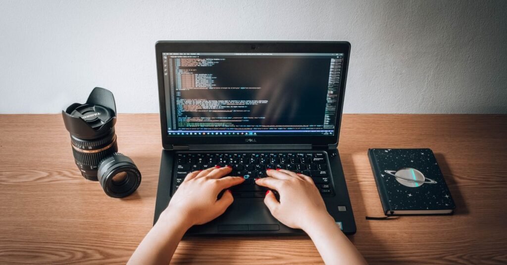 Laptop showing code on a desk
