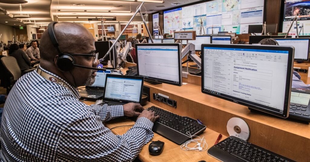 An operator working at a multi-monitor workstation