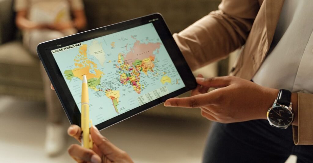 Person viewing a world map on a tablet
