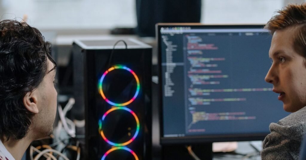 Two developers working at a computer