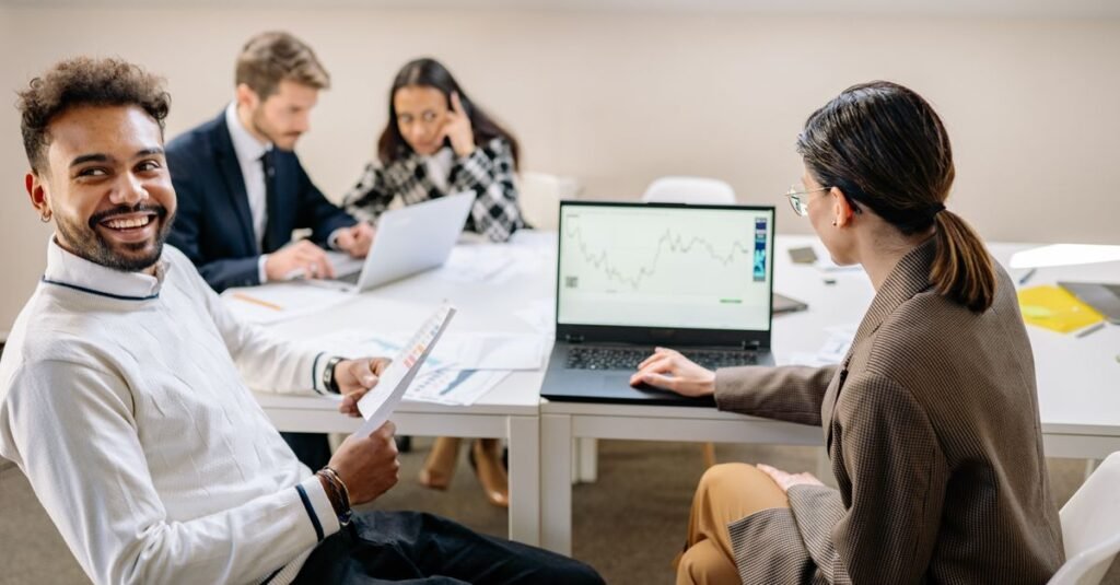 A team analyzing data together on a laptop